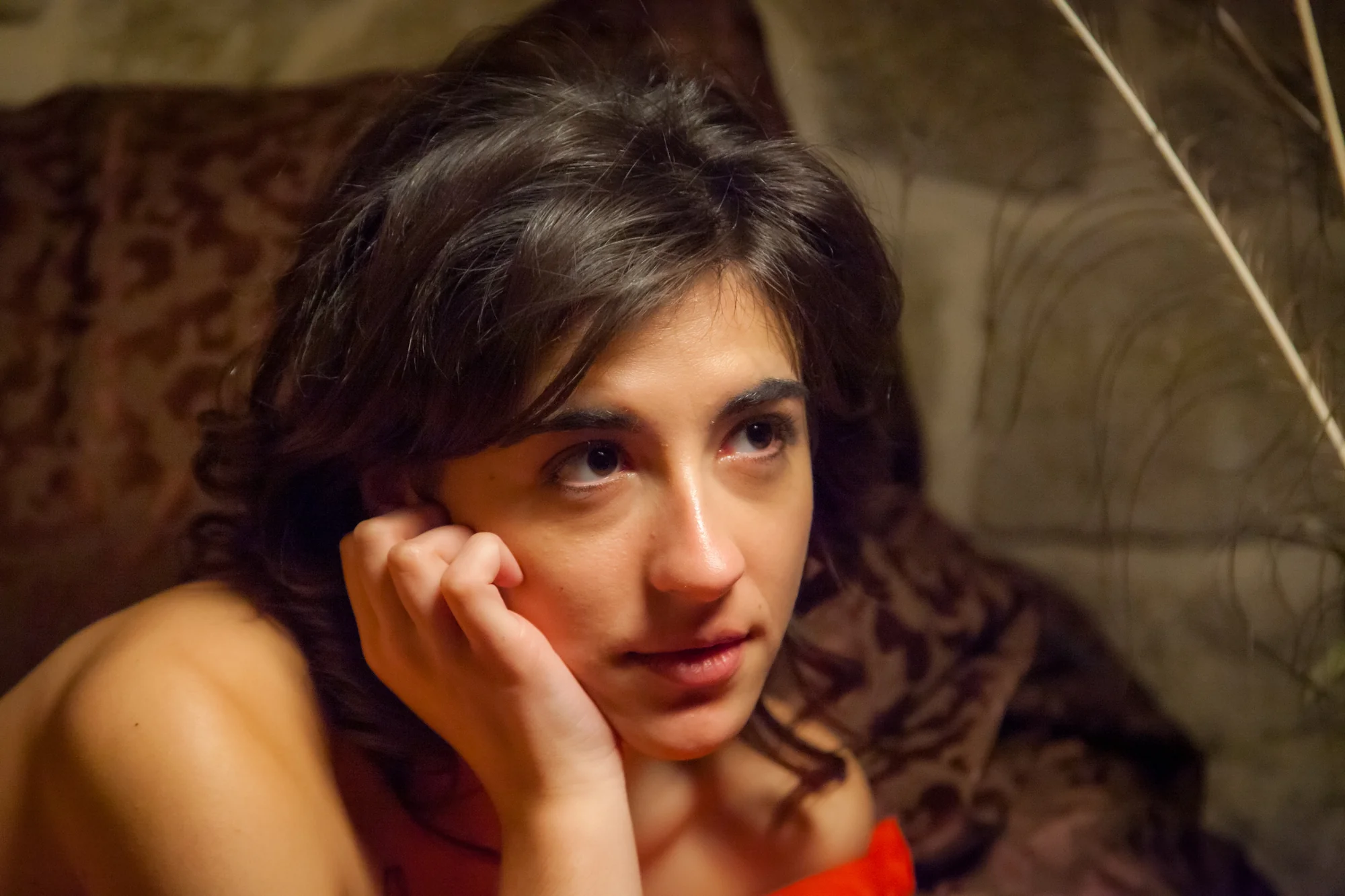 Afra looks out of frame during filming.